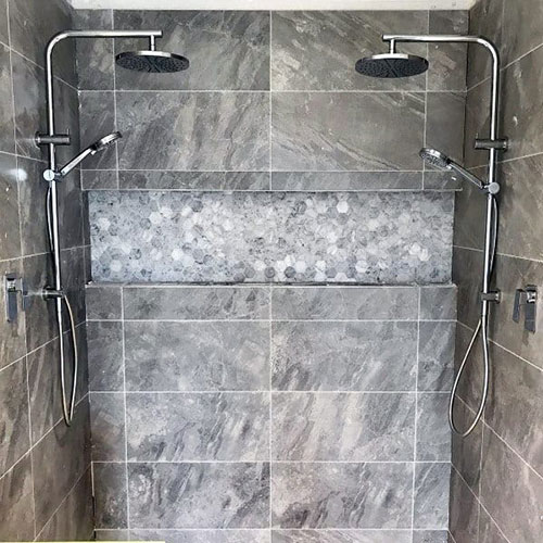 Grey bathroom with twin shower
