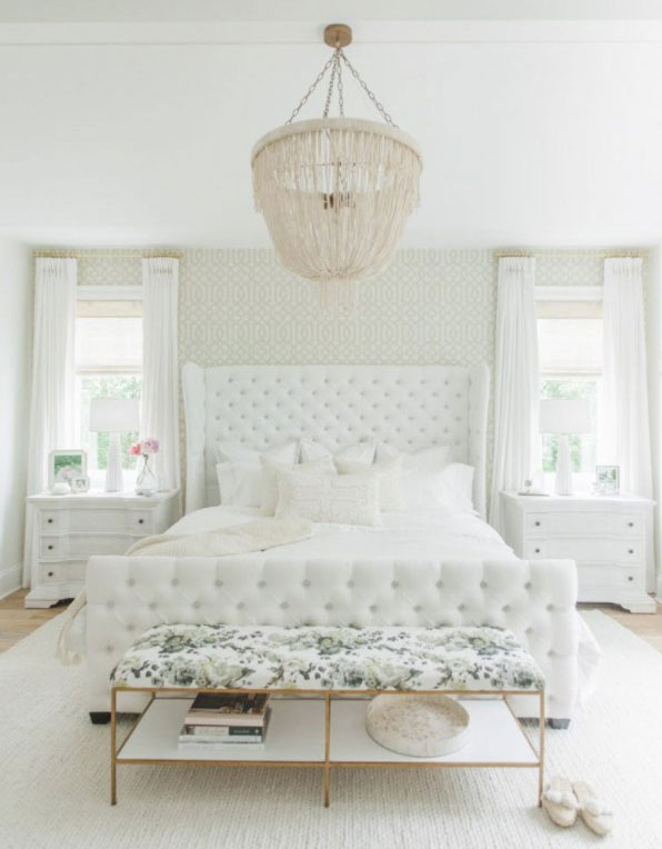 White bedroom with chandelier
