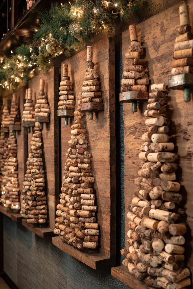 Wine Cellar Wall with Wine Cork Christmas Trees and Vintage Bottle Lights